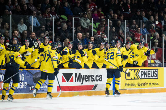 Anton Wahlberg of Sweden celebrates with team mates