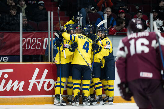 Anton Wahlberg of Sweden celebrates with team mates