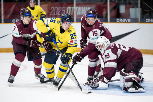 Davids Livsics, Darels Uljanskis and goaltender Linards