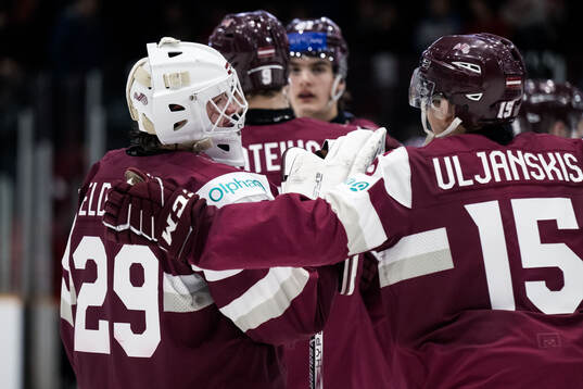 Goaltender Linards Feldbergs of Latvia looks dejected