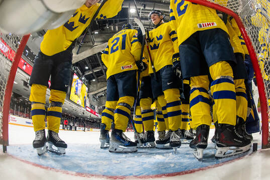 Rasmus Bergqvist of Sweden celebrates with team mates