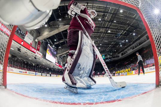 Goaltender Linards Feldbergs of Latvia looks dejected