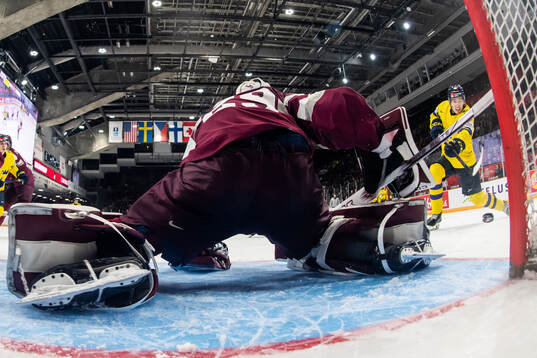David Edstrom of Sweden scores 3-0 bahind goaltender