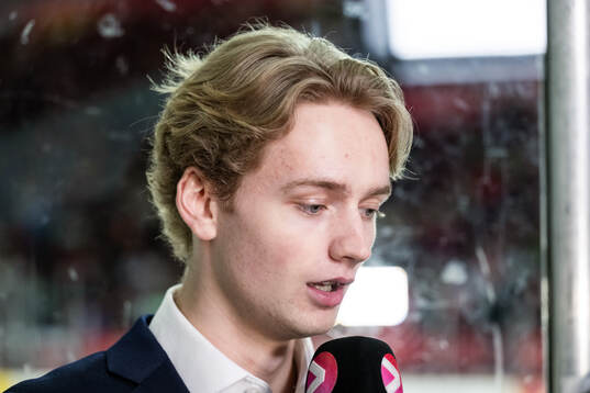 Goaltender Melvin Strahl of Sweden is iinterviewed in the