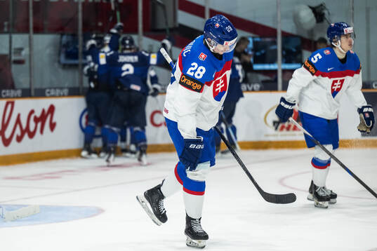 Tomas Kralovic of Slovakia looks dejected while Rasmus
