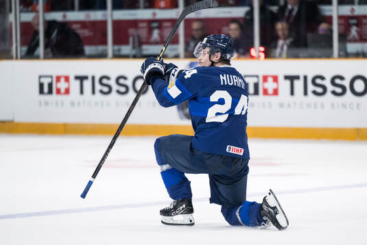 Jesse Nurmi of Finland celebrates