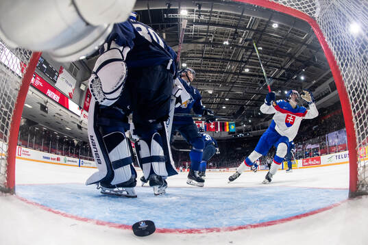 Goaltender Petteri Rimpinen and Aron Kiviharju of Finland