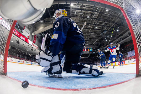 Goaltender Petteri Rimpinen and Banjamin Rautiainen of