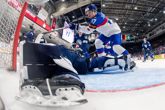 Goaltender Petteri Rimpinen of Finland with a save against