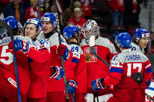 Adam Novotny and goaltender Michael Hrabal of Czech