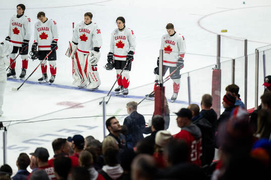 Jett Luchanko, Bradly Nadeau, goaltender Carter George and
