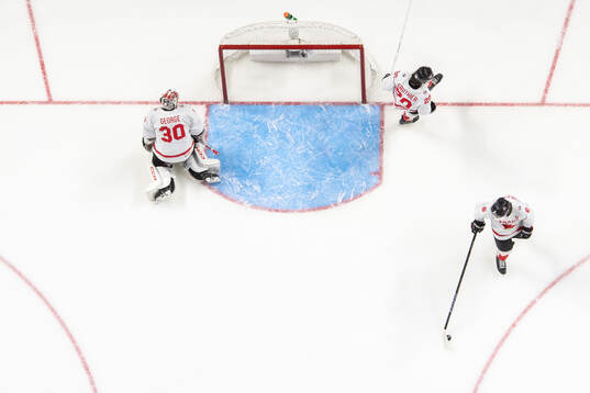Goaltender Carter George, Ethan Gauthier and Tanner