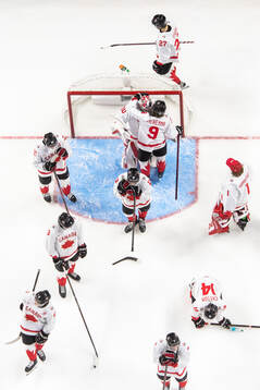 Goaltender Carter George and Gavin McKenna of Canada look