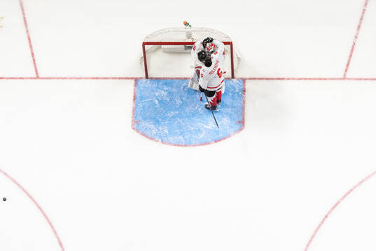 Goaltender Carter George and Tanner Molendyk of Canada look