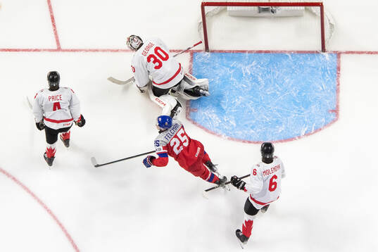 Caden Price goaltender Carter George and Tanner Molendyk of