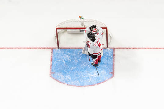 Goaltender Carter George and Tanner Molendyk of Canada look