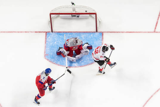 Jakub Fibigr and goaltender Michael Hrabal of Czech