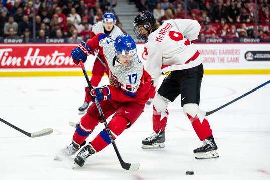 Petr Sikora of Czech Republic and Gavin McKenna of Canada