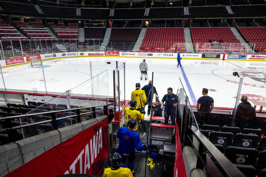 Players of Sweden enter the ice at a practice session