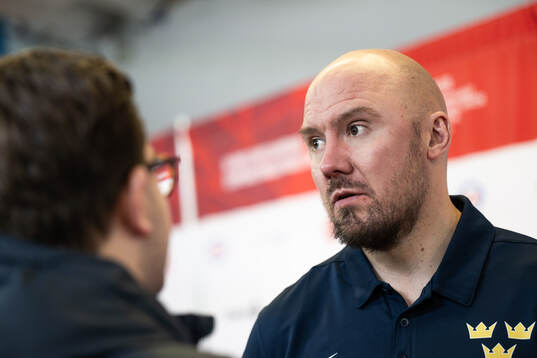 Assistant coach Nicklas Grossmann of Sweden is interviewed