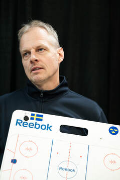 Head coach Magnus Hävelid of Sweden is interviewed holding