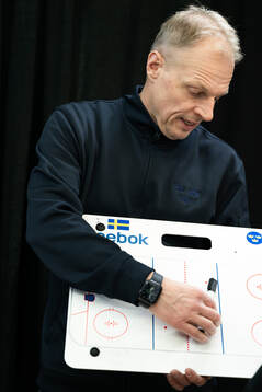 Head coach Magnus Hävelid of Sweden is interviewed holding