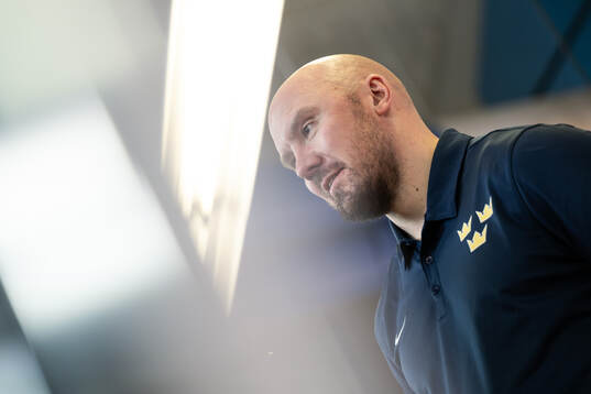 Assistant coach Nicklas Grossmann of Sweden is interviewed