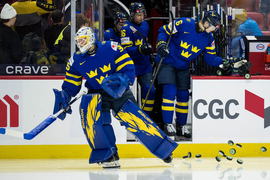 Goaltender Melker Thelin, Axel Hurtig and Felix Unger