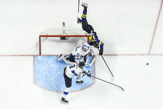 Goaltender Petteri Rimpinen of Finland and Linus Eriksson