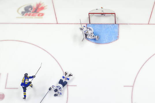 Otto Stenberg of Sweden scores the 1-0 goal behind