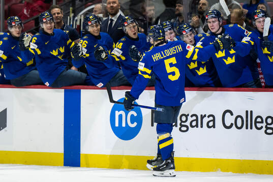 Wilhelm Hallquist of Sweden celebrate with teammates