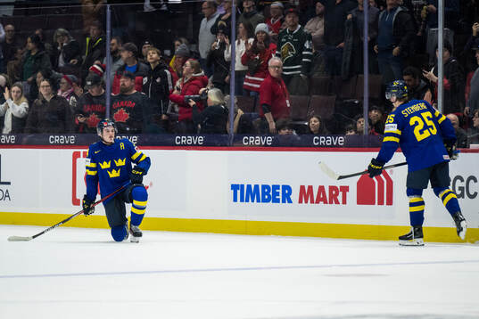 Tom Willander and Otto Stenberg of Sweden look dejected