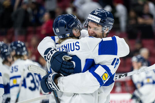 Konsta Helenius and Rasmus Kumpulainen of Finland celebrate