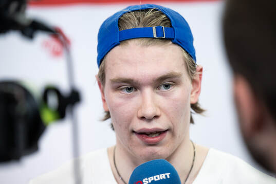 Julius Miettinen of Finland is interviewed in the mixedzone