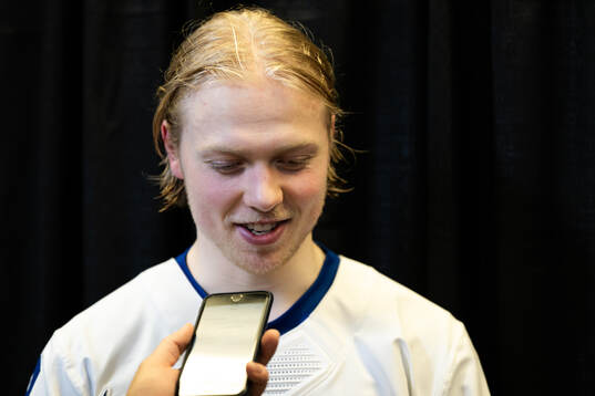 Konsta Helenius of Finland is interviewed in the mixedzone