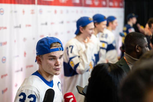 Aron Kiviharju of Finland is interviewed in the mixedzone