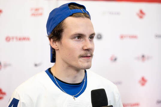 Jesse Nurmi of Finland is interviewed in the mixedzone