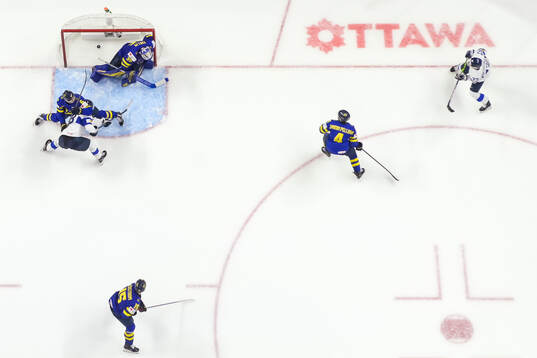 Rasmus Kumpulainen sees Benjamin Rautiainen of Finland