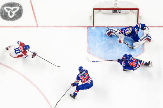 Adam Jecho of Czech Republic with a shot that is saved by