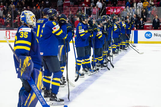 Herman Träff and team mates of Sweden look dejected