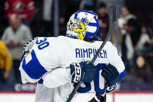 Goaltender Petteri Rimpinen of Finland celebrates with a