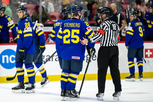 Otto Stenberg of Sweden in discussion with referee Sean