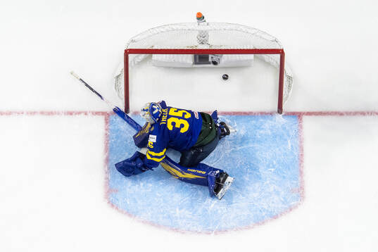 Goaltender Melker Thelin of Sweden looks dejected