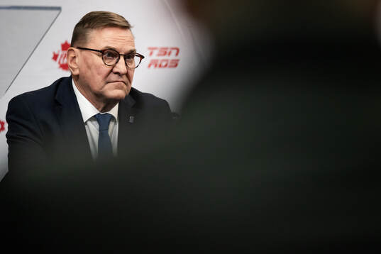 Heikki Hietanen council member of IIHF at a IIHF press