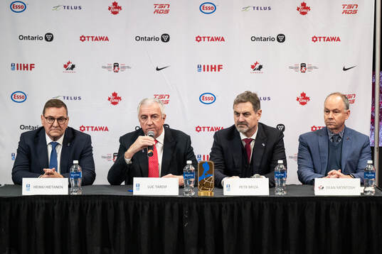 Heikki Hietanen council member of IIHF, Luc Tardif