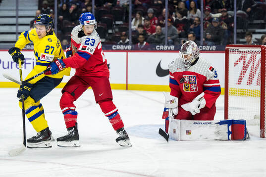 David Granberg of Sweden and Tomas Galvas and goaltender