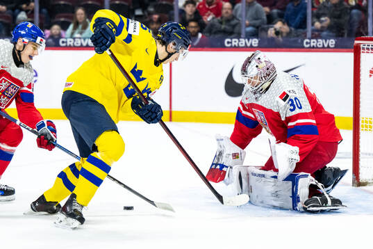 David Edstrom of Sweden scores 1-1 behind goaltender