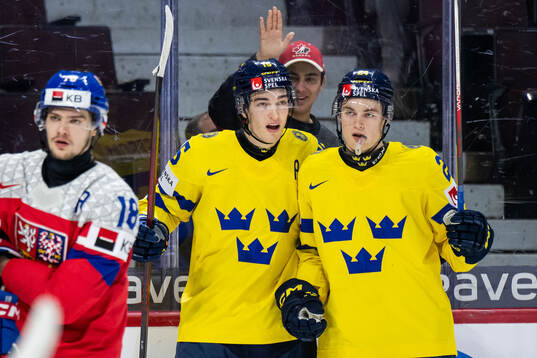 David Edstrom and Tom Willander of Sweden celebrate scoring