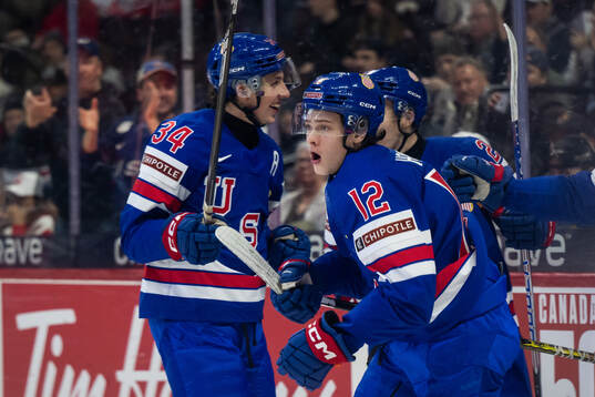 James Hagens of USA celebrates with team mates