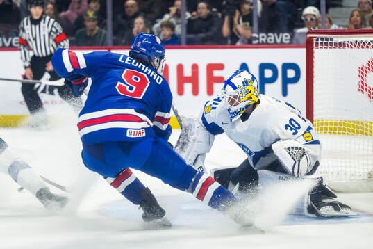 Ryan Leonard of USA and goaltender Petteri Rimpinen of